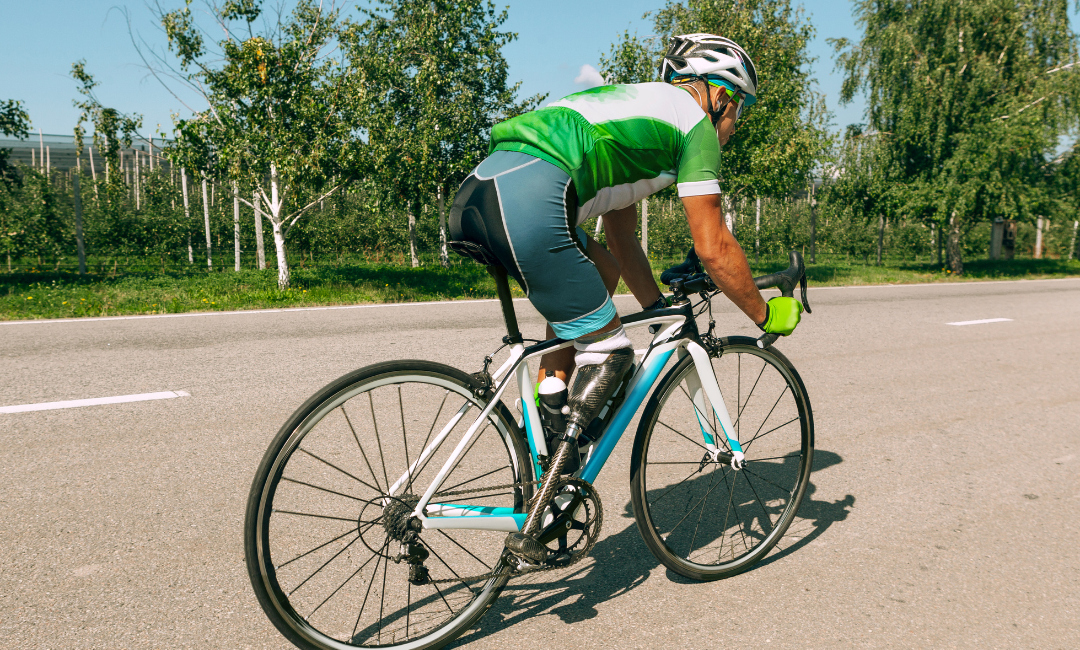 Para cycling: Disabled cyclist improving cardio health and strength outdoors.
